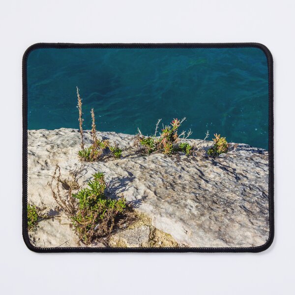 Item preview, Rocky Coastal Cliff With Succulent Plants Overlooking Deep Blue Sea At Sunny Day designed and sold by Nmallia.