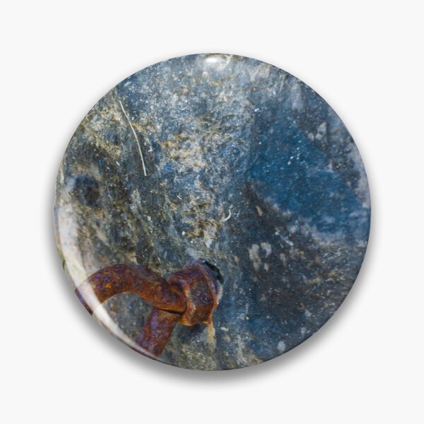 Item preview, Rusty Iron Ring Bolt Anchored in Weathered Rock Surface With Textured Stone Background designed and sold by Nmallia.