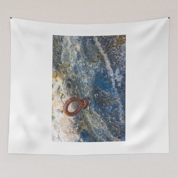 Item preview, Rusty Iron Ring Bolt Anchored in Weathered Rock Surface With Textured Stone Background designed and sold by Nmallia.