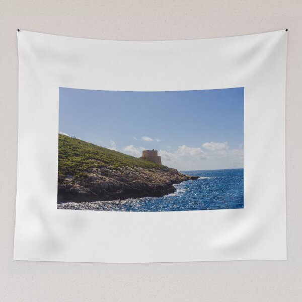 Item preview, Historic Coastal Watchtower On Rocky Headland Over Sparkling Blue Sea Under Sunny Sky And Clouds designed and sold by Nmallia.