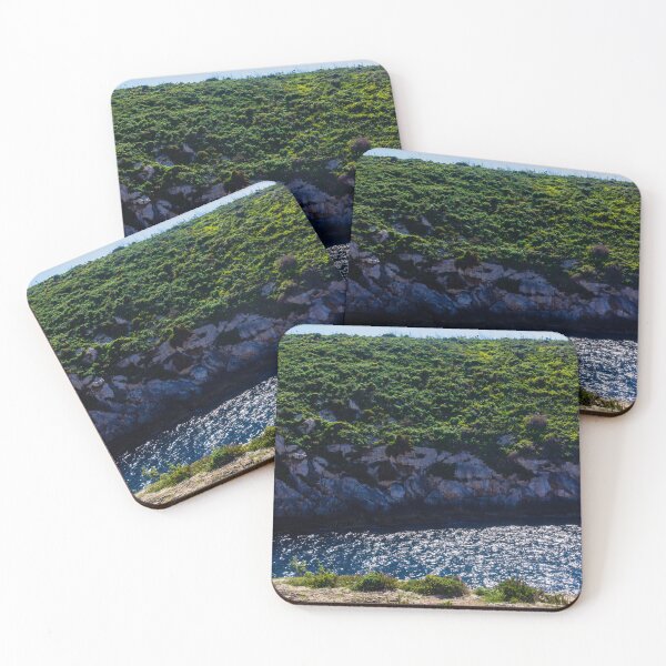 Item preview, Green Coastal Cliff Over Sparkling Blue Sea With Rocky Shoreline On Sunny Summer Day designed and sold by Nmallia.