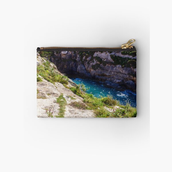 Item preview, Sunlit Rocky Coastal Inlet With Turquoise Water, Wildflowers and Rugged Limestone Cliffs designed and sold by Nmallia.