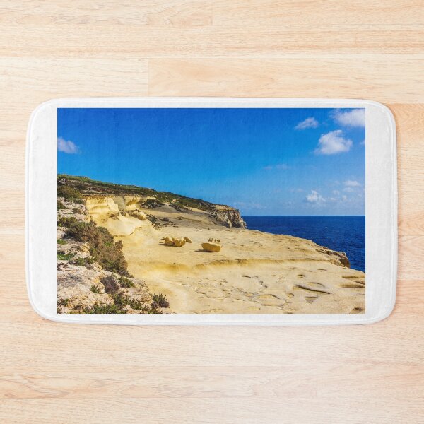 Item preview, Golden Sandstone Cliffs Overlooking Deep Blue Sea Under Clear Sky — Coastal Landscape and Eroded Rock Formations designed and sold by Nmallia.