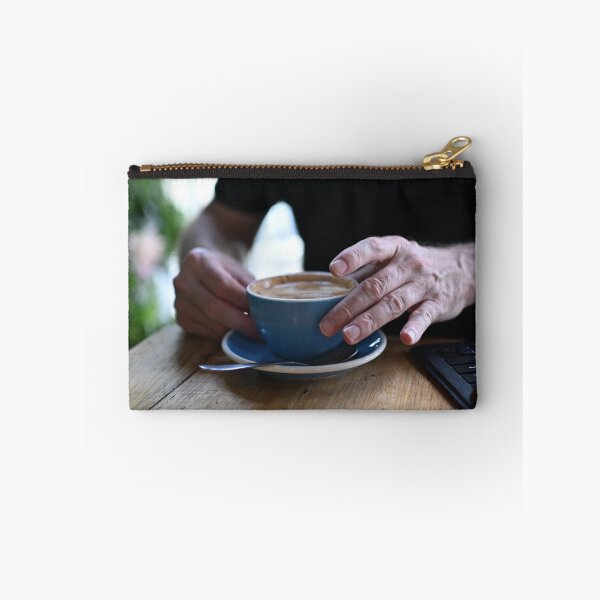 Item preview, Man Holding Cappuccino at Restaurant designed and sold by getmybookstore.
