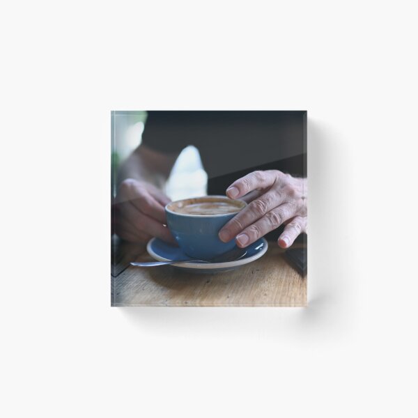 Item preview, Man Holding Cappuccino at Restaurant designed and sold by getmybookstore.
