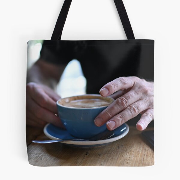 Item preview, Man Holding Cappuccino at Restaurant designed and sold by getmybookstore.