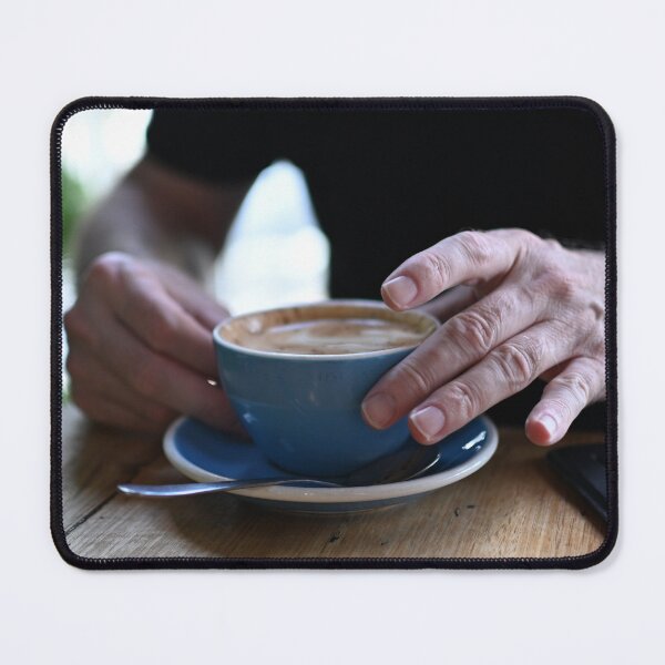 Item preview, Man Holding Cappuccino at Restaurant designed and sold by getmybookstore.