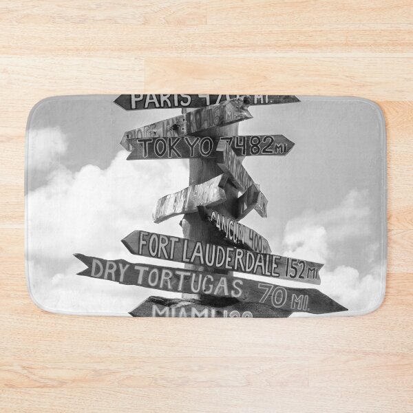 Item preview, Fort Zachary Taylor Beach, Key West direction sign to London, Paris, Nassau, Honolulu, Hawaii black and white photograph designed and sold by Astrid Arkhangelsky.