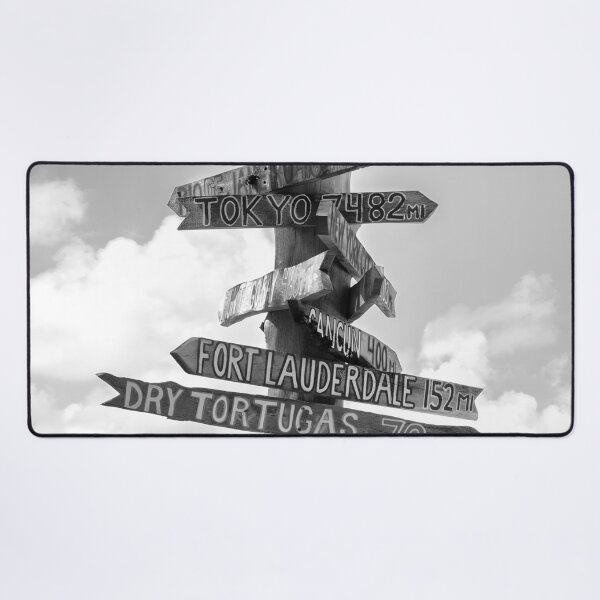 Item preview, Fort Zachary Taylor Beach, Key West direction sign to London, Paris, Nassau, Honolulu, Hawaii black and white photograph designed and sold by Astrid Arkhangelsky.