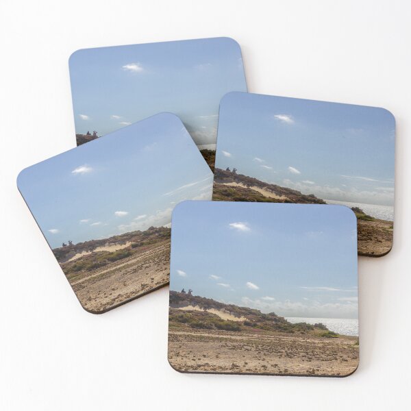 Item preview, Couple On Coastal Dune Overlooking Shimmering Ocean Under Clear Blue Sky designed and sold by Nmallia.