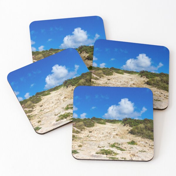 Item preview, Rocky Coastal Path Leading Up Through Scrubland Under A Bright Blue Sky With Puffy Clouds designed and sold by Nmallia.