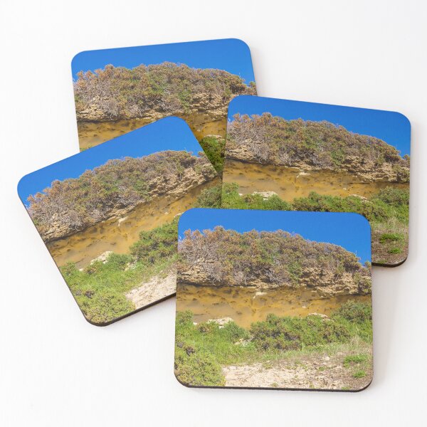 Item preview, Sunlit Coastal Sandstone Cliff With Scrub Shrubs, Rocky Vegetation and Clear Blue Sky designed and sold by Nmallia.