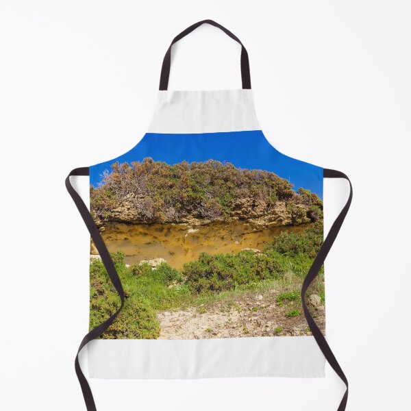 Item preview, Sunlit Coastal Sandstone Cliff With Scrub Shrubs, Rocky Vegetation and Clear Blue Sky designed and sold by Nmallia.