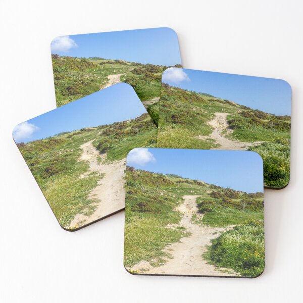 Item preview, Rocky Coastal Path Leading Up Through Scrubland Under A Bright Blue Sky With Puffy Clouds designed and sold by Nmallia.