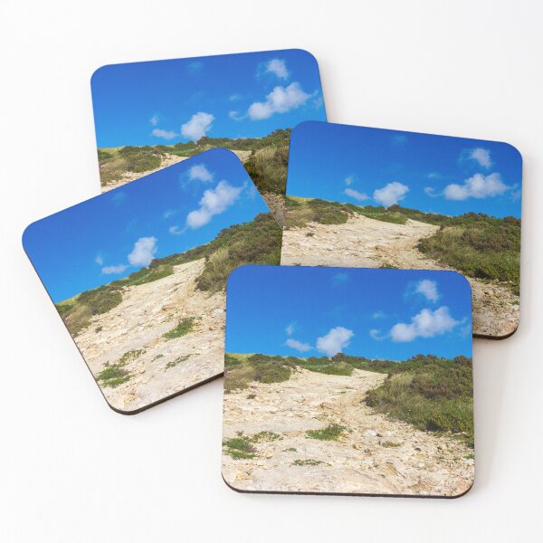 Item preview, Rocky Coastal Path Leading Up Through Scrubland Under A Bright Blue Sky With Puffy Clouds designed and sold by Nmallia.