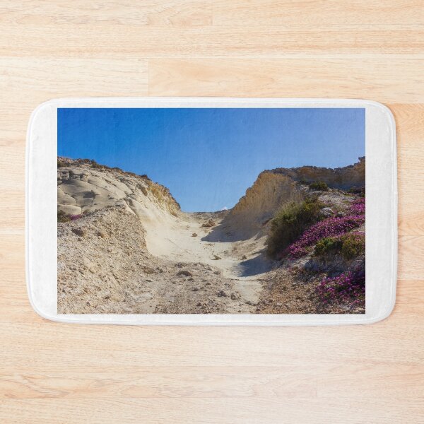 Item preview, Rocky Coastal Path Leading Up Through Scrubland Under A Bright Blue Sky With Puffy Clouds designed and sold by Nmallia.