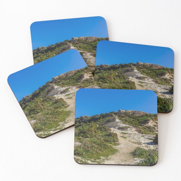 Item preview, Rocky Coastal Path Leading Up Through Scrubland Under A Bright Blue Sky With Puffy Clouds designed and sold by Nmallia.