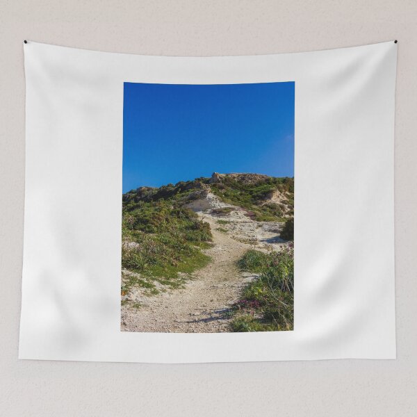 Item preview, Rocky Coastal Path Leading Up Through Scrubland Under A Bright Blue Sky With Puffy Clouds designed and sold by Nmallia.