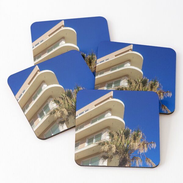 Item preview, Modern Apartment Building With Curved Balconies and Palm Tree Against Deep Blue Sky designed and sold by Nmallia.