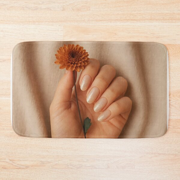 Item preview, Woman Hand with Natural Beige Ombre Nails and Golden Sparkle Holding Small Orange Flowers designed and sold by EmeraldeaArt.