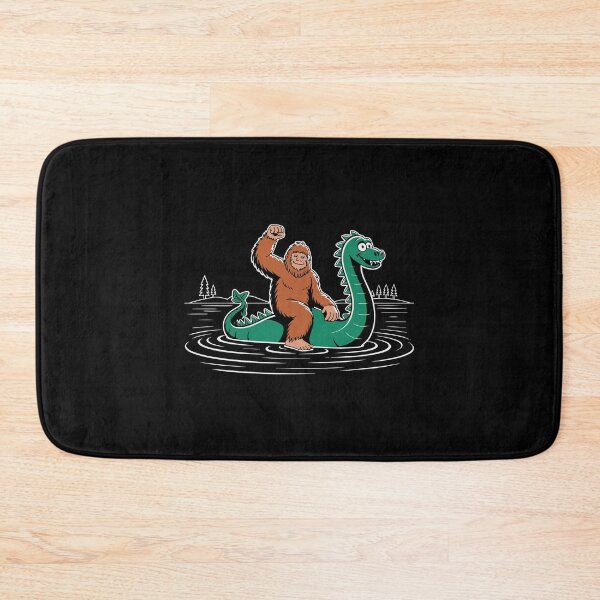 Item preview, Funny Bigfoot Riding Loch Ness Monster Cartoon Cryptid Kids Design designed and sold by w1ckerman.