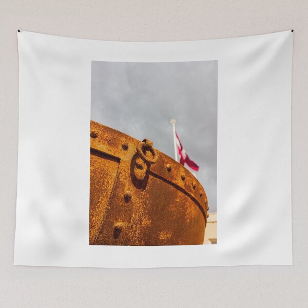 Item preview, Rusty Metal Hull With Heavy Ring Detail and Blurred Flagpole Against Stormy Sky designed and sold by Nmallia.