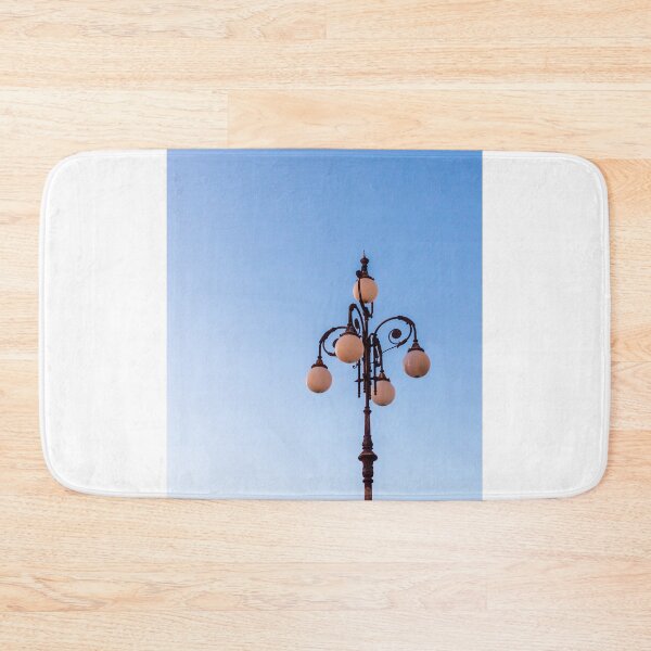 Item preview, Vintage Street Lamp Against Clear Blue Sky With Ornate Globe Lights at Dusk designed and sold by Nmallia.