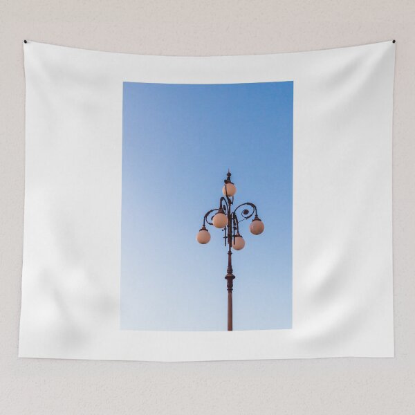 Item preview, Vintage Street Lamp Against Clear Blue Sky With Ornate Globe Lights at Dusk designed and sold by Nmallia.