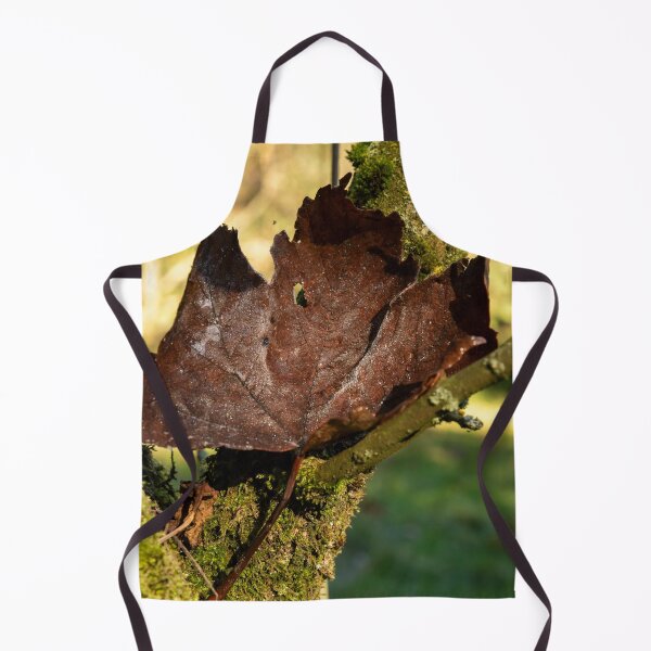 Item preview, Crisp dark brown leaf on mossy branch designed and sold by Stephen Jarman.