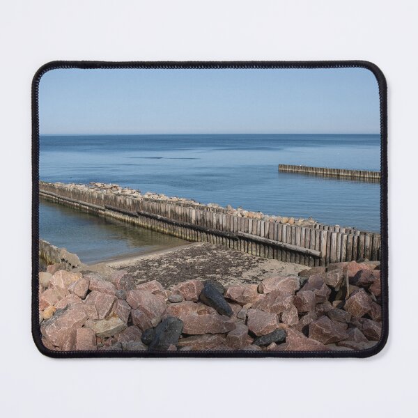 Item preview, Calm Sea with Wooden Breakwaters and Rocky Shoreline designed and sold by VisualMoodFoto.