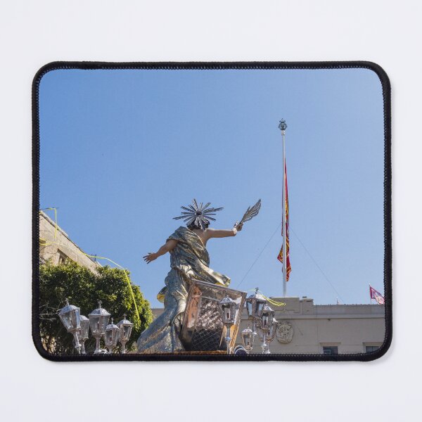 Item preview, Religious Procession Statue On Ornate Float With Spanish Flag Against Clear Blue Sky designed and sold by Nmallia.