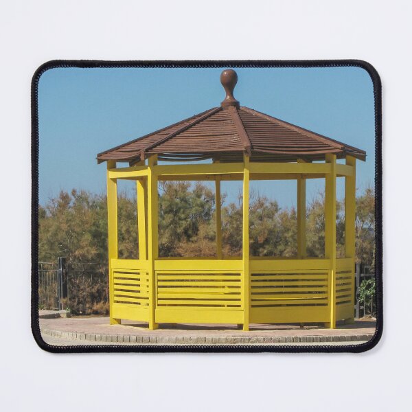 Item preview, Yellow Wooden Gazebo Pavilion On Seafront Promenade With Brown Roof And Blue Sky designed and sold by Nmallia.