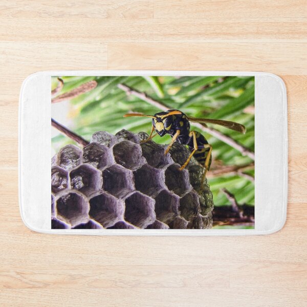 Item preview, Close-Up of a Paper Wasp on Its Nest Showing Hexagonal Cells and Yellow-Black Markings designed and sold by Nmallia.