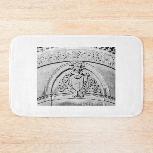 Item preview, Stone Architectural Crest And Ornamental Relief On Historic Building Facade In Black And White designed and sold by Nmallia.