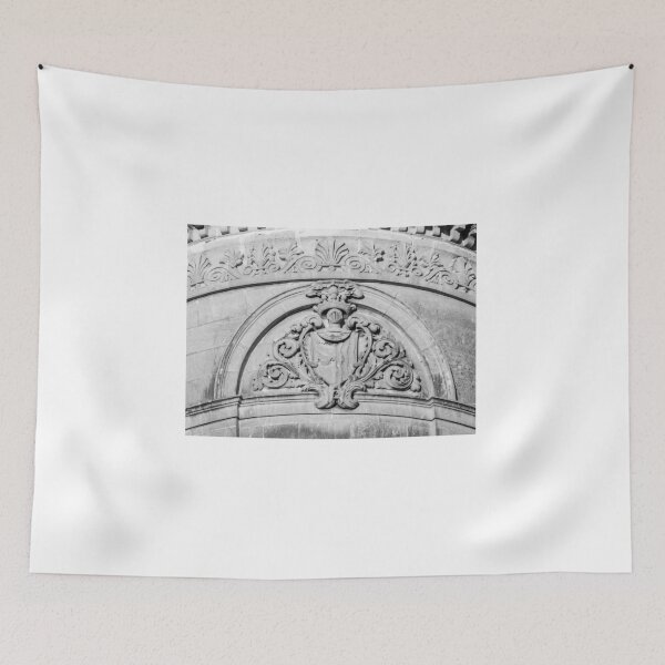 Item preview, Stone Architectural Crest And Ornamental Relief On Historic Building Facade In Black And White designed and sold by Nmallia.