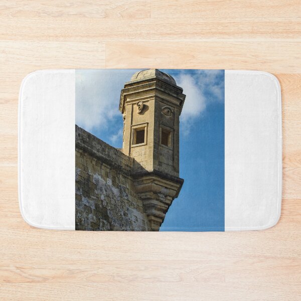 Item preview, Historic Stone Watchtower With Carved Eye and Ear Motifs on Fort Wall Under Blue Sky designed and sold by Nmallia.