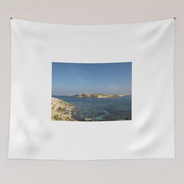 Item preview, Rocky Coastal Island With Statue Over Clear Blue Mediterranean Sea On Sunny Day designed and sold by Nmallia.