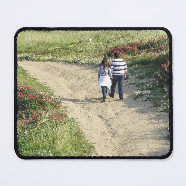 Item preview, Couple Walking Along A Dirt Path Through Flower-Covered Countryside On A Sunny Spring Afternoon designed and sold by Nmallia.