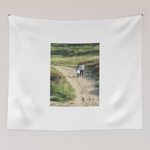 Item preview, Couple Walking Along A Dirt Path Through Flower-Covered Countryside On A Sunny Spring Afternoon designed and sold by Nmallia.