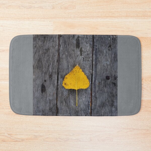 Item preview, Single Yellow Leaf on Rustic Wood – Minimal Autumn Composition designed and sold by onubi.