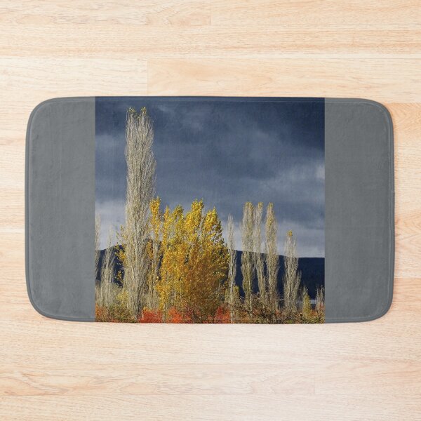 Item preview, Golden Autumn Trees Under Dark Sky – Dramatic Nature Landscape designed and sold by onubi.