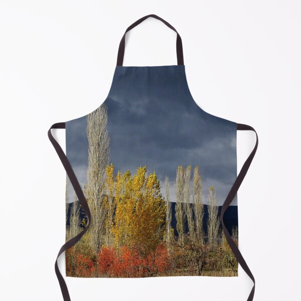 Item preview, Golden Autumn Trees Under Dark Sky – Dramatic Nature Landscape designed and sold by onubi.