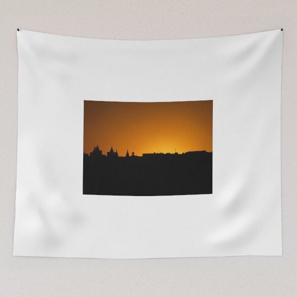 Item preview, City Skyline Silhouette At Orange Sunset With Historic Rooftops And Church Spires Against Sky designed and sold by Nmallia.