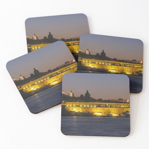 Item preview, Illuminated Coastal Fortress at Dusk Over Calm Harbor Water With Historic City Silhouette designed and sold by Nmallia.