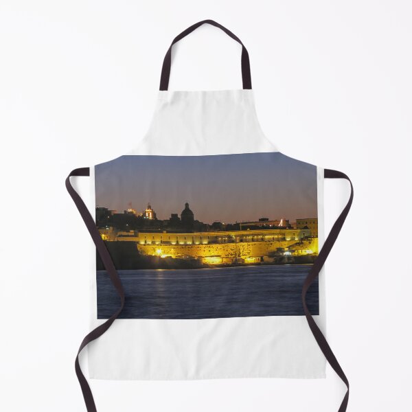 Item preview, Illuminated Coastal Fortress at Dusk Over Calm Harbor Water With Historic City Silhouette designed and sold by Nmallia.