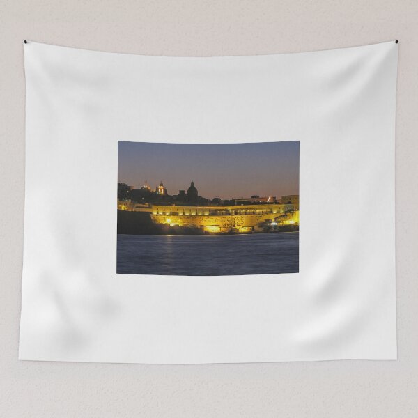 Item preview, Illuminated Coastal Fortress at Dusk Over Calm Harbor Water With Historic City Silhouette designed and sold by Nmallia.