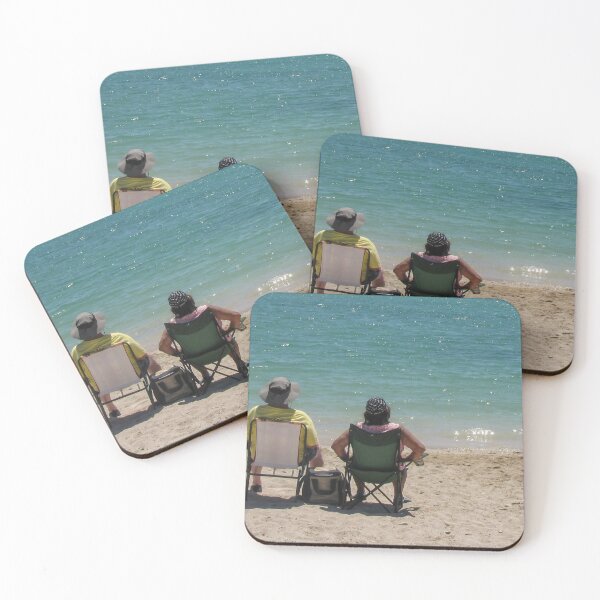 Item preview, Couple Sitting in Beach Chairs Facing Turquoise Ocean Waves Relaxing on Sunny Sandy Shore designed and sold by Nmallia.