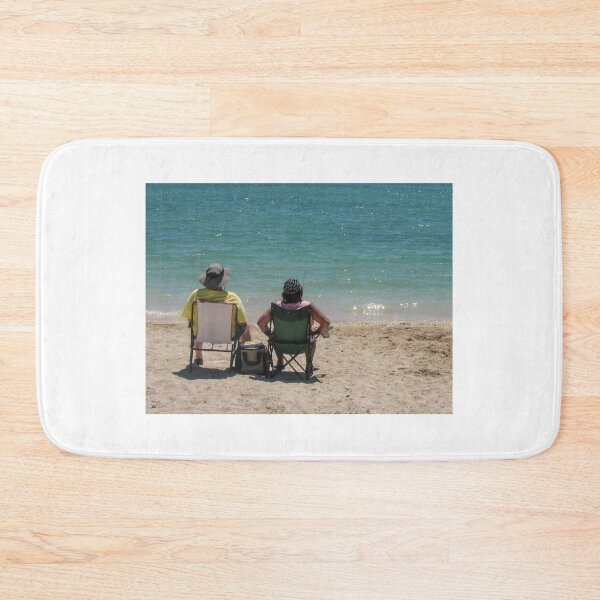 Item preview, Couple Sitting in Beach Chairs Facing Turquoise Ocean Waves Relaxing on Sunny Sandy Shore designed and sold by Nmallia.