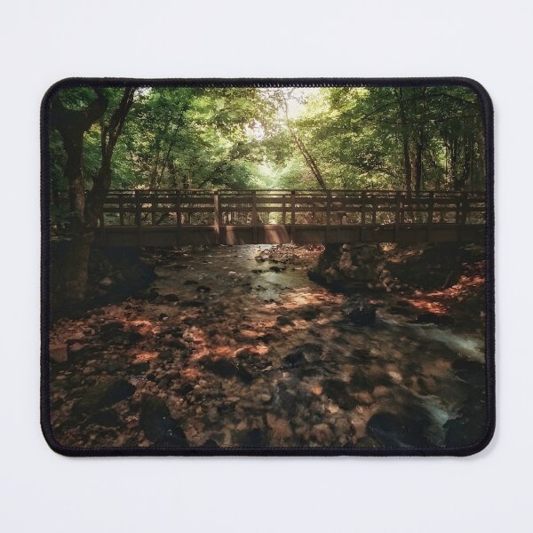 Item preview, Wooden Bridge Over Forest Stream | Sun-Drenched Nature Photography | Woodland Creek Path designed and sold by SergioMiklos.