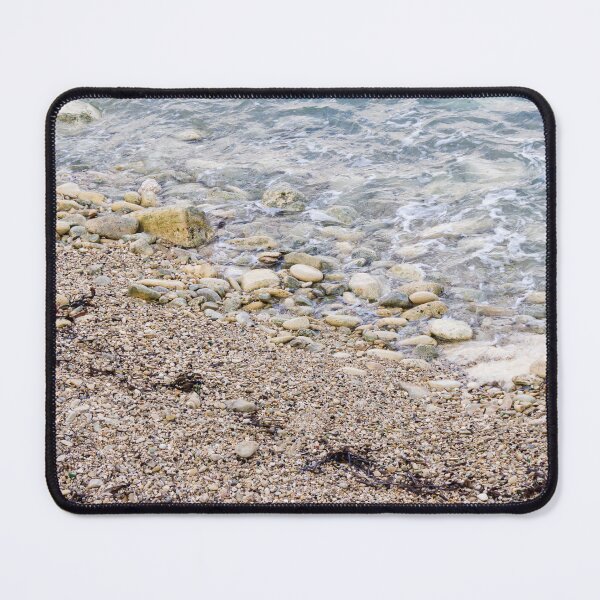 Item preview, Pebble Beach Shoreline With Gentle Waves, Rocks And Seaweed On A Calm Coastal Seashore designed and sold by Nmallia.